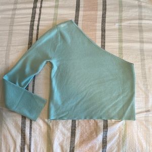 One sleeve light blue sweater